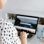 A woman working from home on a laptop, illustrating a freelance lifestyle.